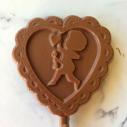 Heart lollipop with cupid motif, molded in solid milk, dark or white chocolate